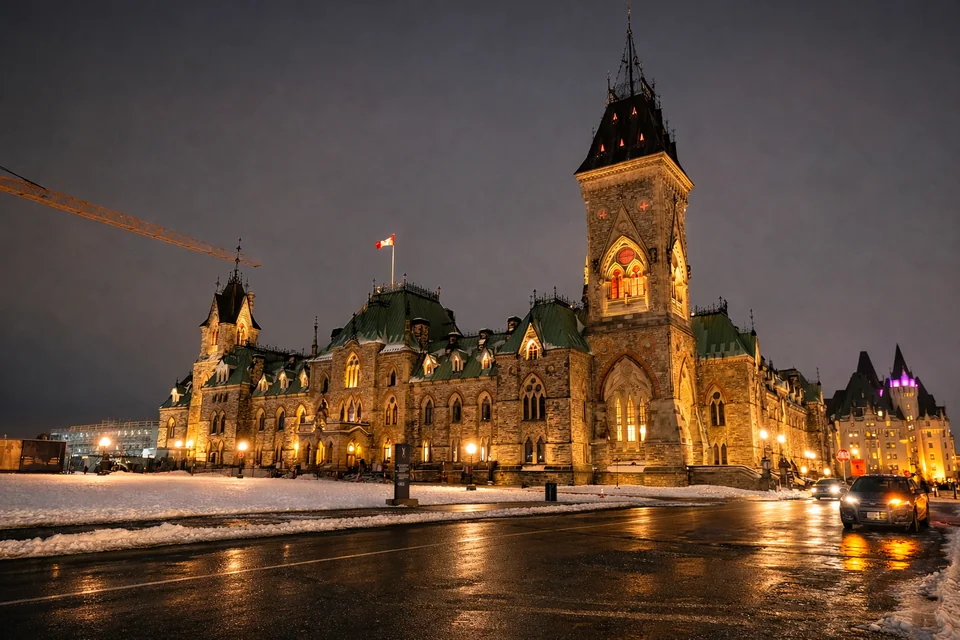 Historic buildings lit in warm tones by the water.
