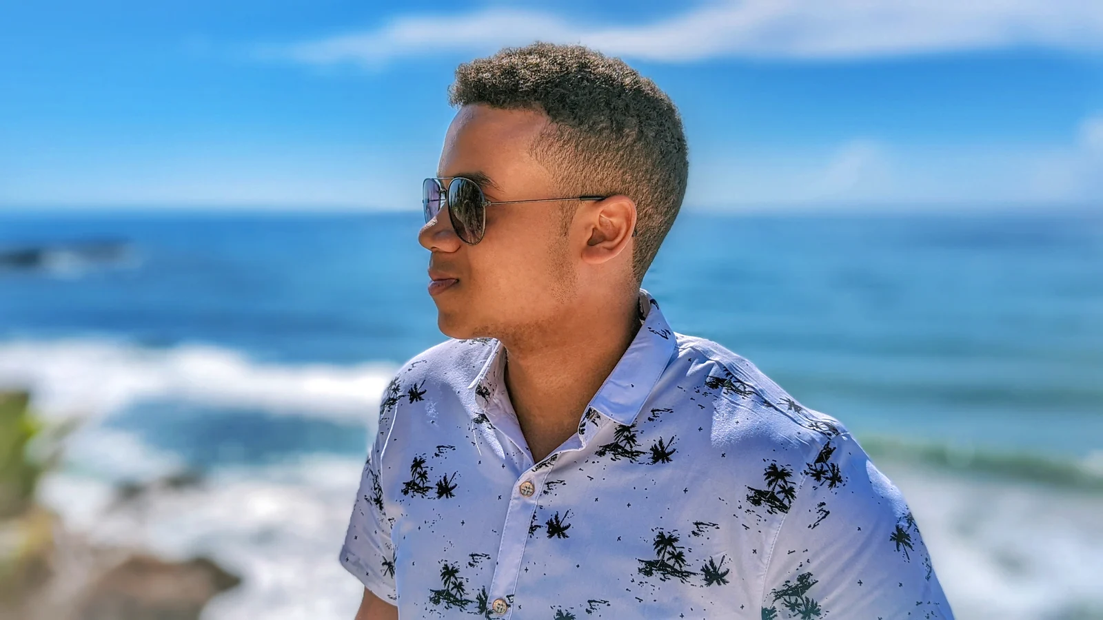Profile portrait of Jonás by the sea