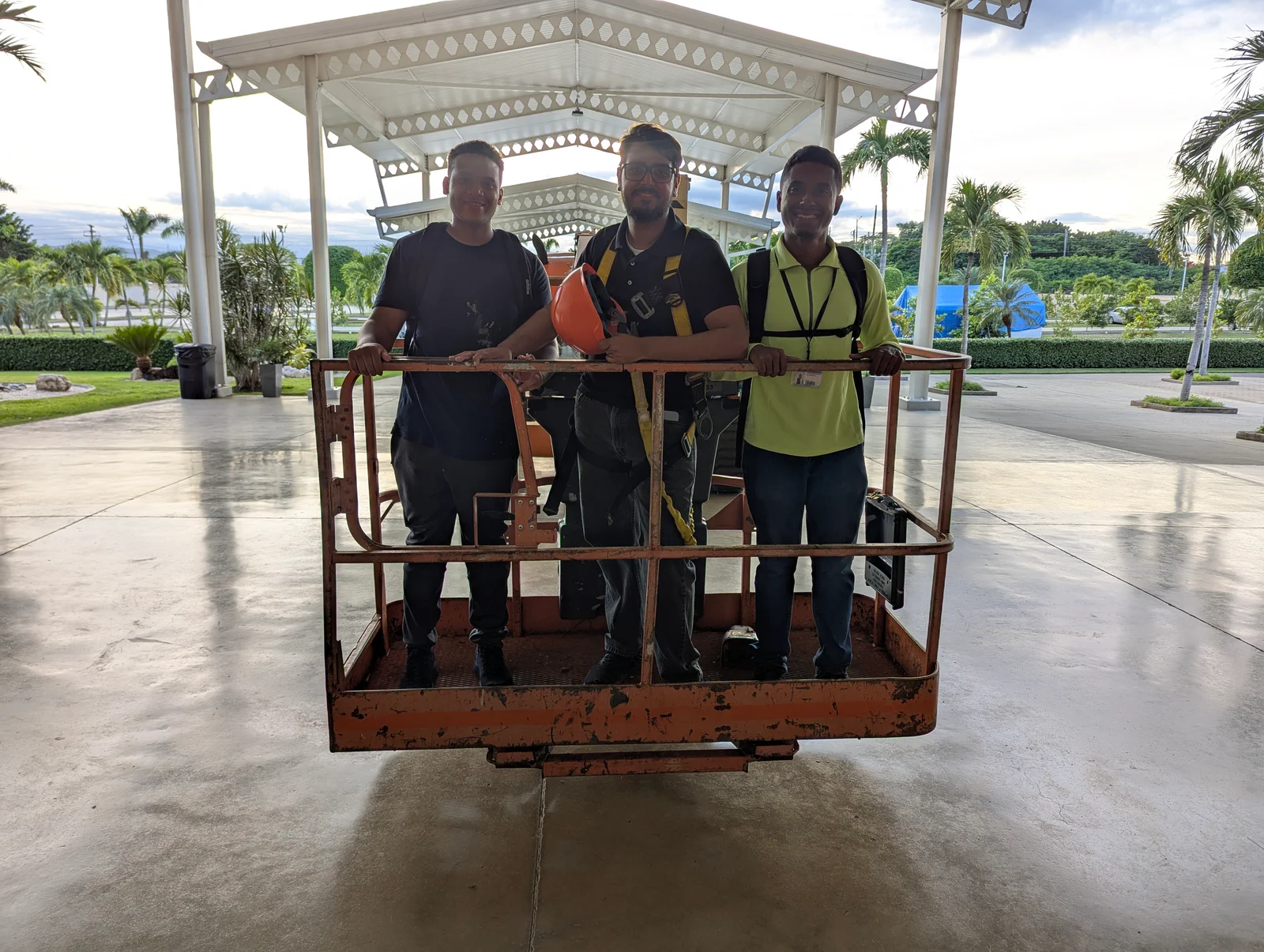 Three volunteers on a work platform